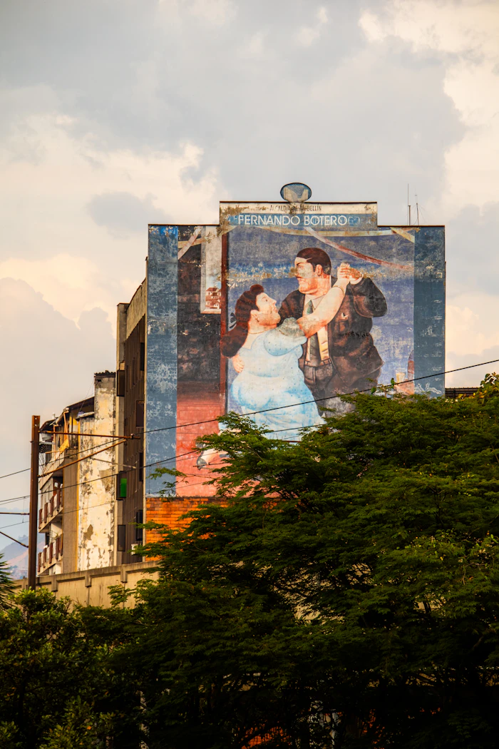 Large colorful mural on a building in Medellín