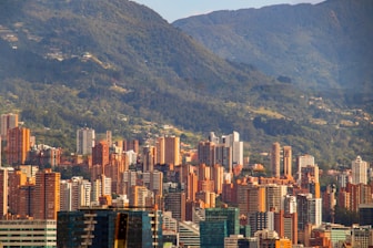 a view of a city with mountains in the background