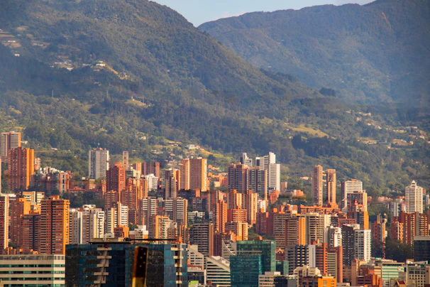 a view of a city with mountains in the background