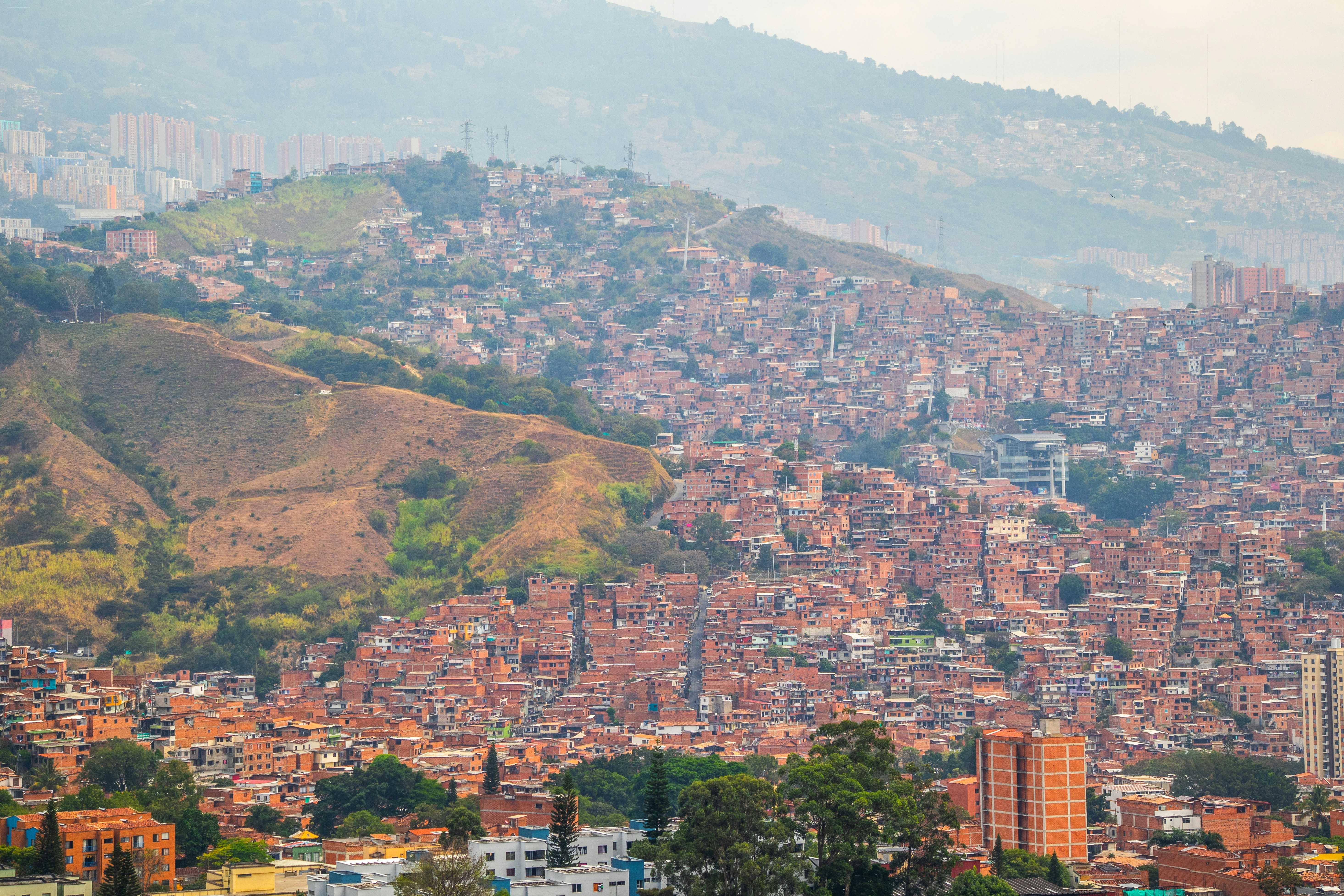 a view of a city with a mountain in the background, 