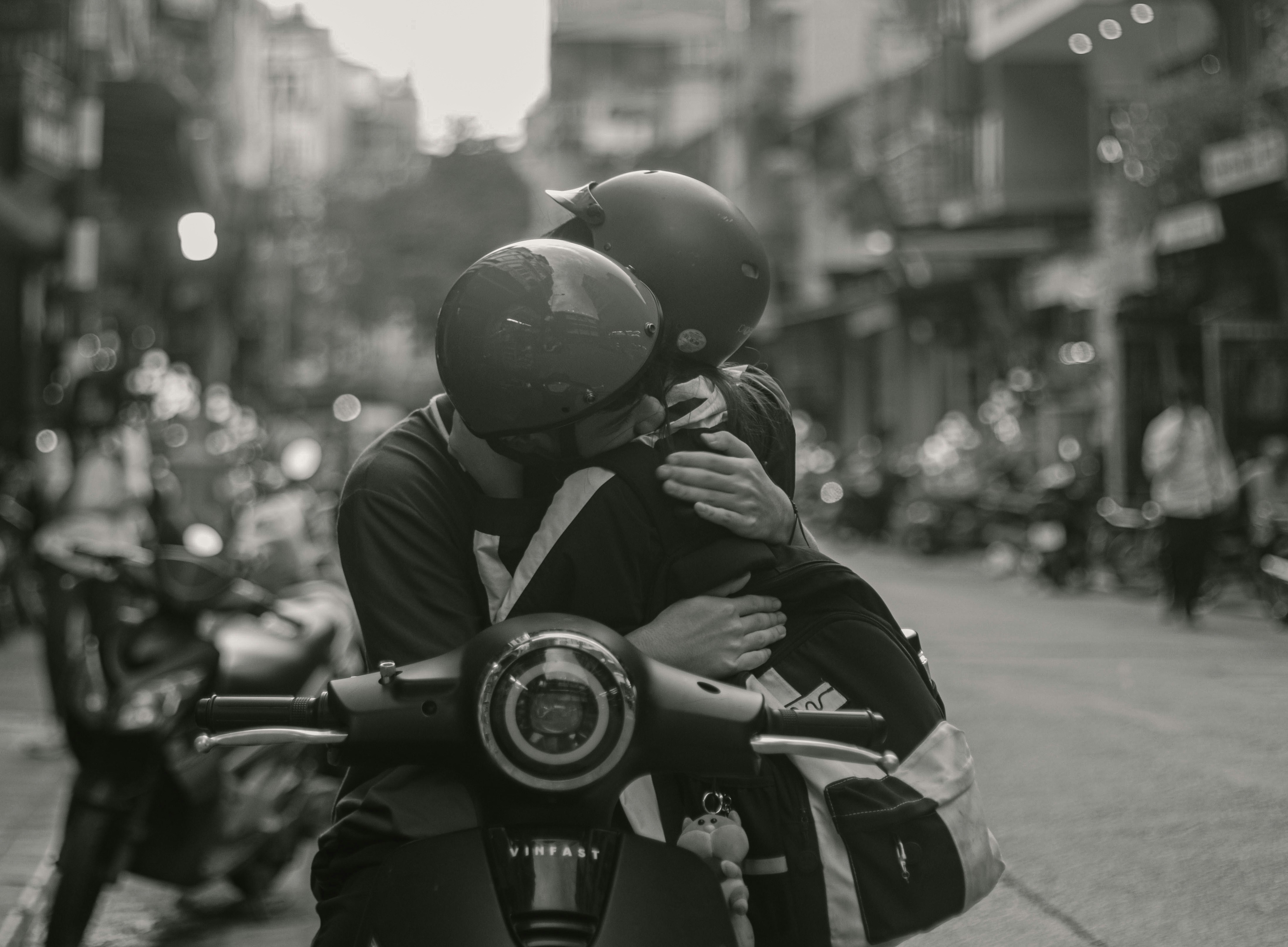 a couple of people that are sitting on a motorcycle