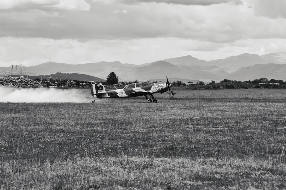 a small plane that is sitting in the grass