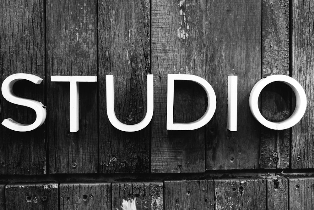 a black and white photo of a sign that says studio