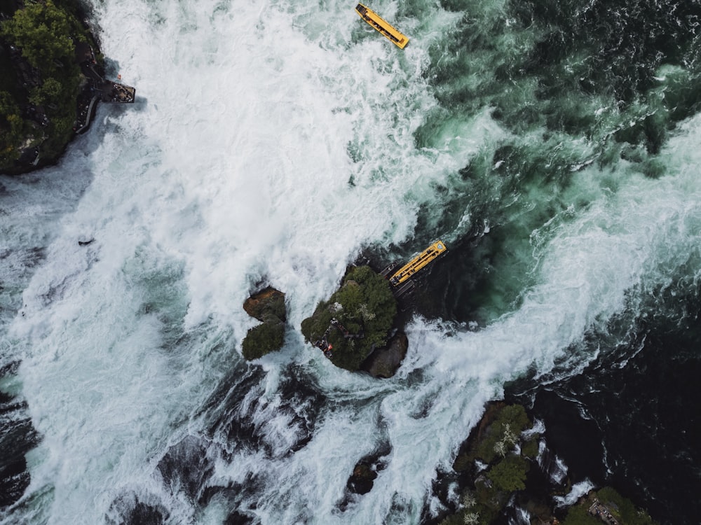 an aerial view of a boat in the ocean