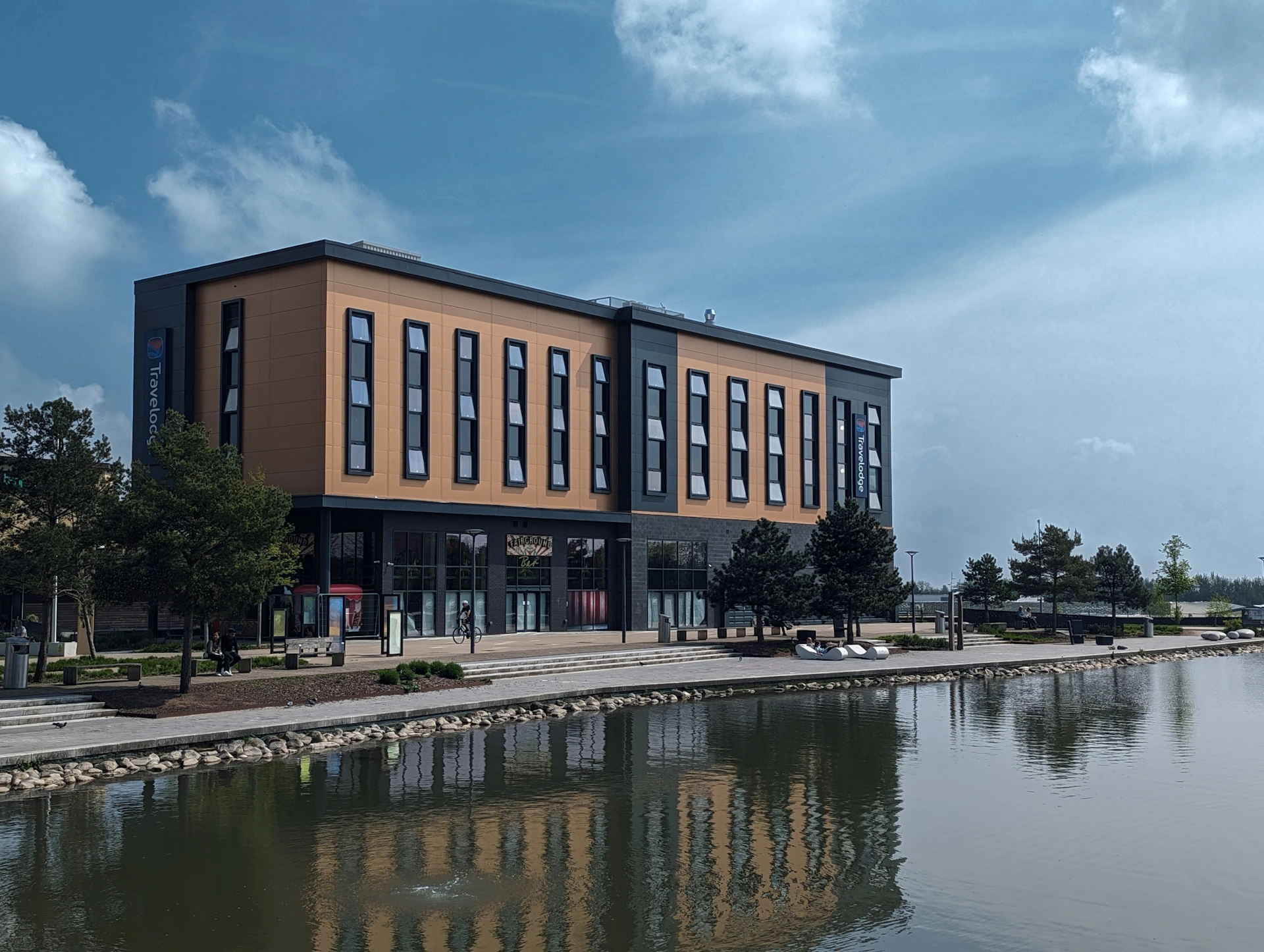 a large building sitting next to a body of water