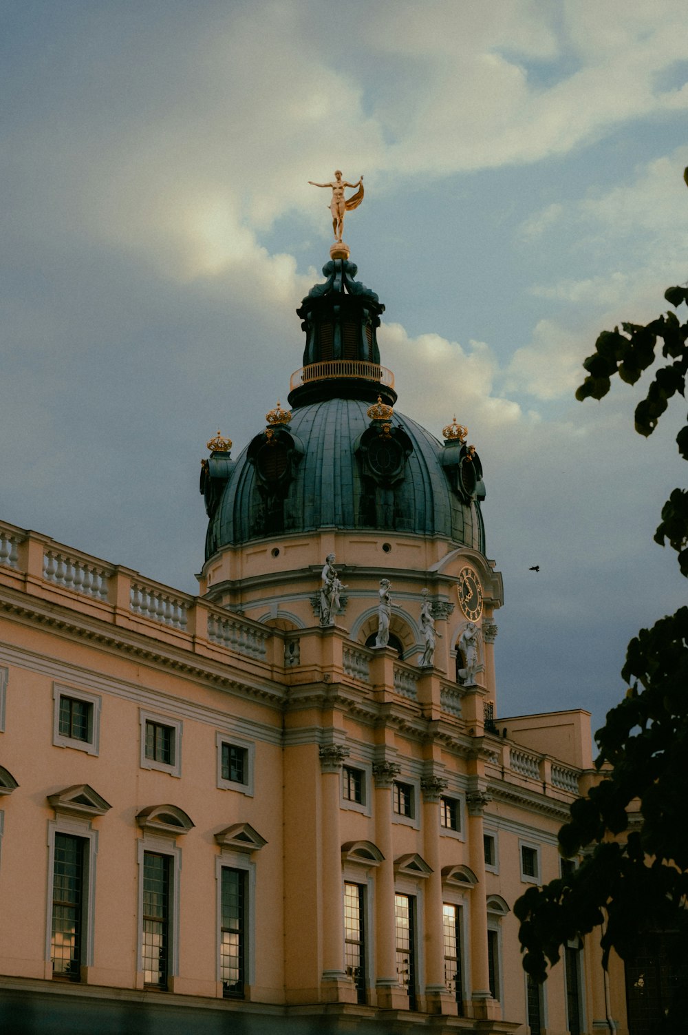 a large building with a dome and a cross on top