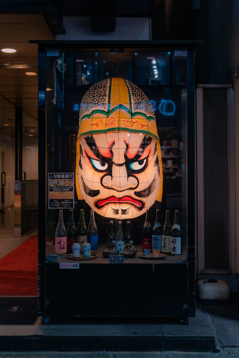 a display case with a mask on it
