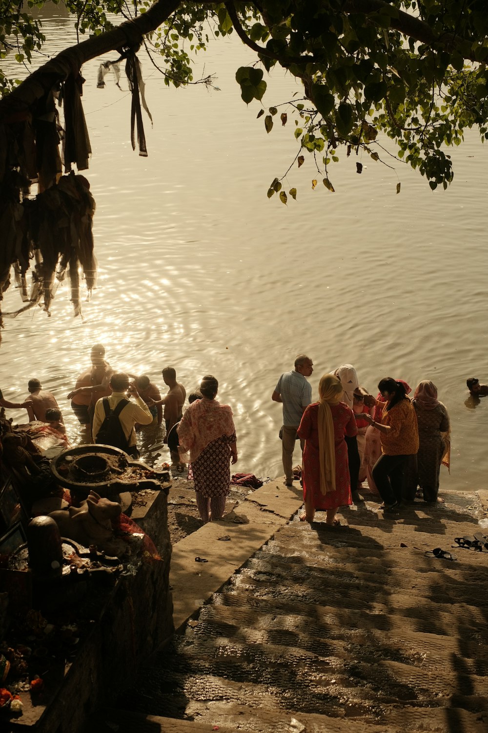 a group of people standing near a body of water