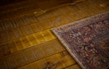 a close up of a rug on a wooden floor