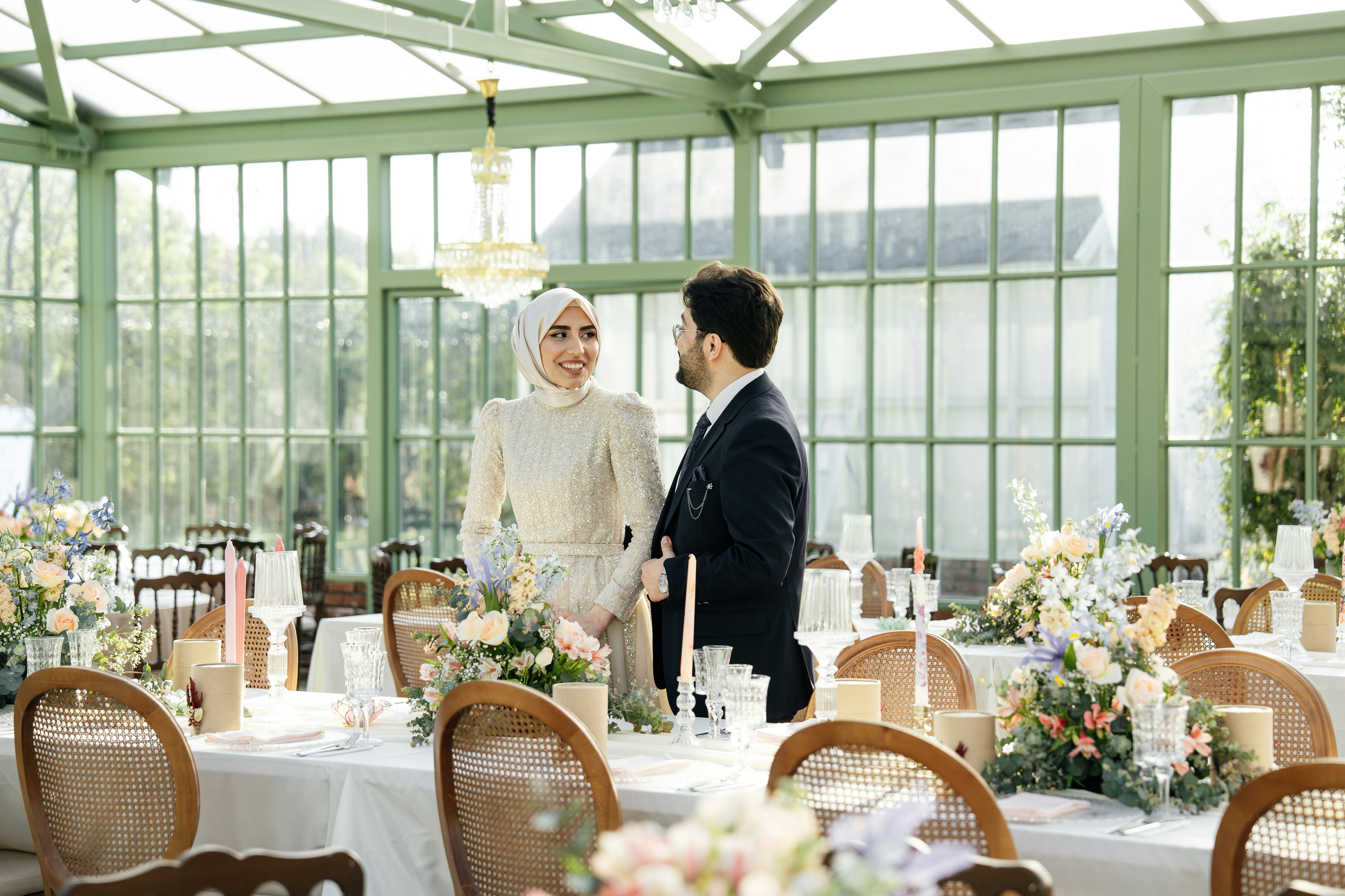 a man and a woman standing in front of a table