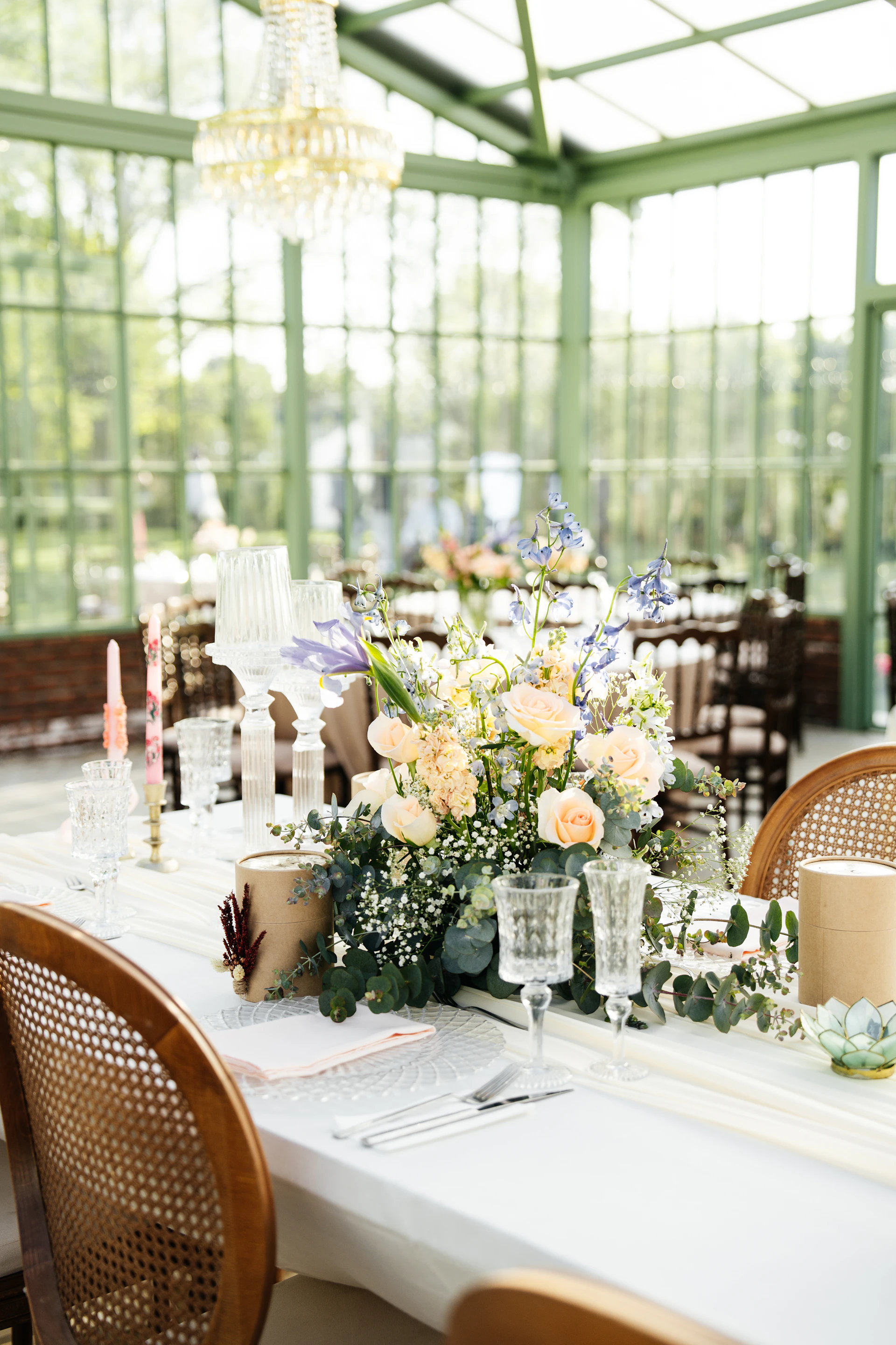 a table with a vase of flowers on top of it