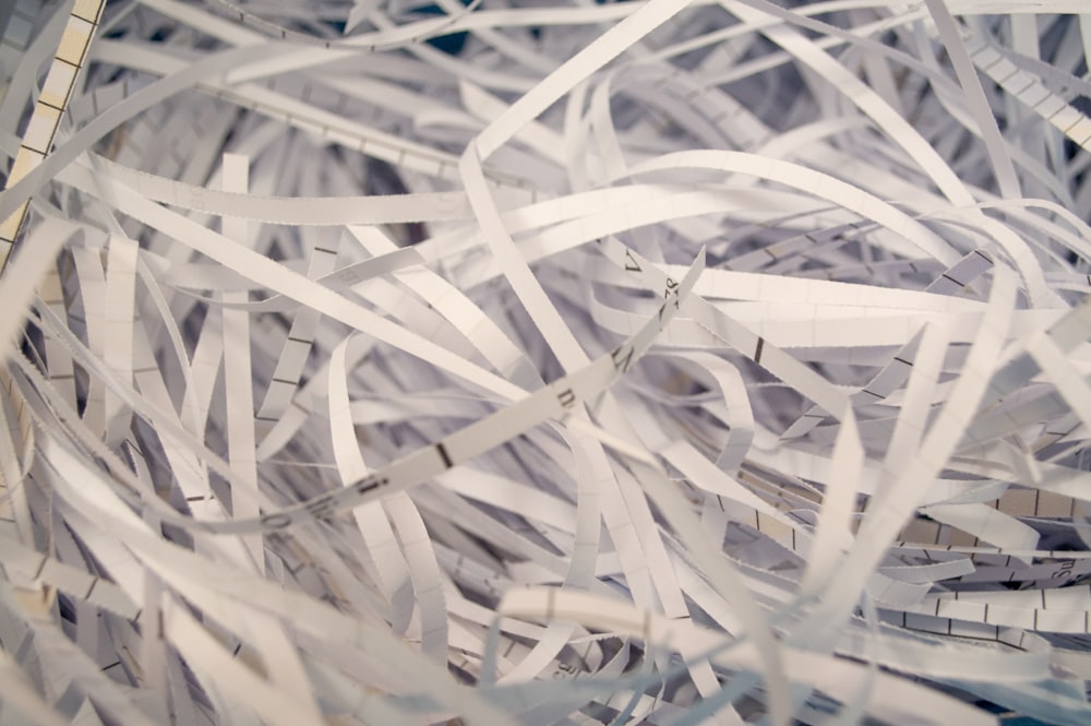 a pile of white shredded paper sitting on top of a table