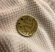 a button with a picture of a cat on it