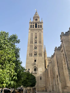 a tall tower with a clock on the top of it
