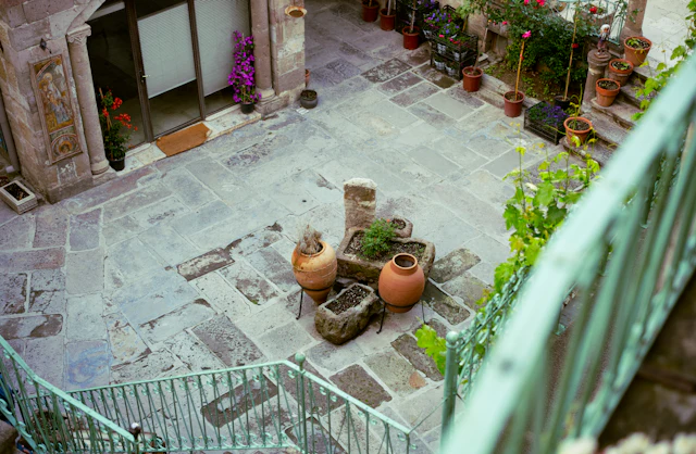 An aerial view of a courtyard with potted plants