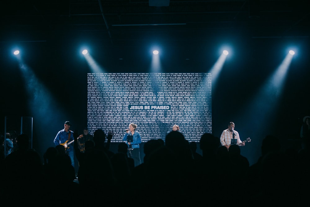 a group of people standing on top of a stage