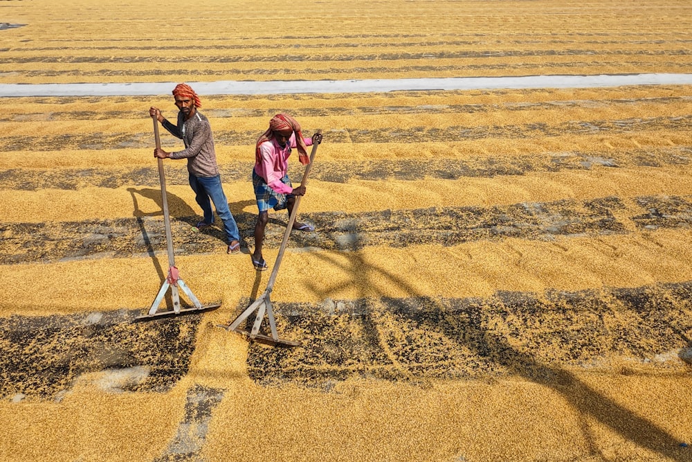 a couple of people that are standing in the dirt