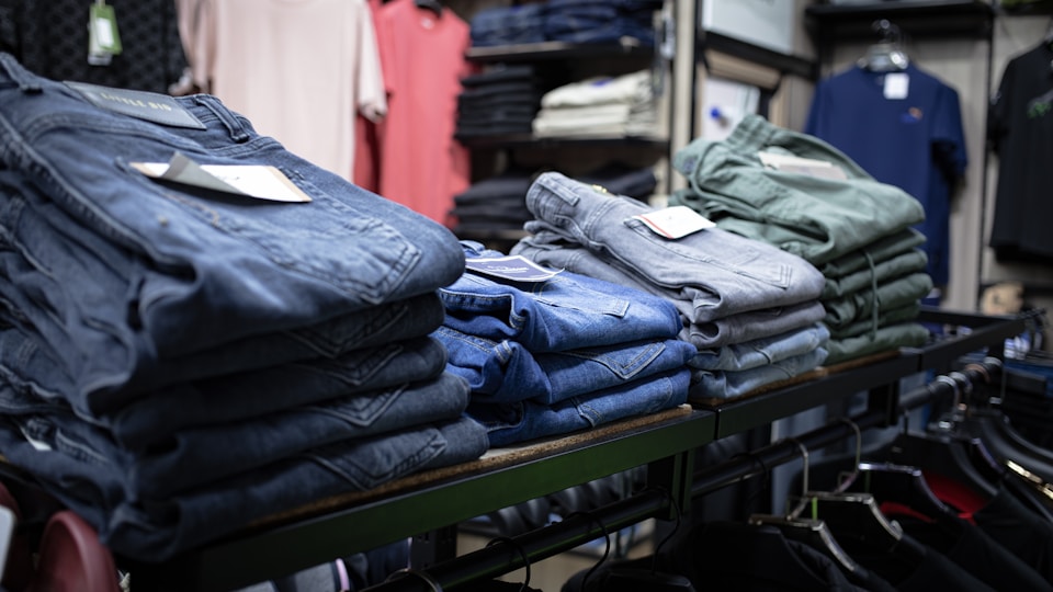 A stock image of a beautifully arranged display table in a clothing and gift boutique, used in a blog by Cannone Marketing.