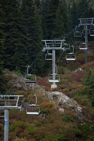 a ski lift going up the side of a mountain
