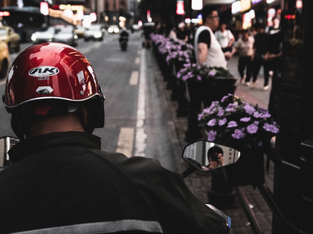 a man in a helmet is looking at the street