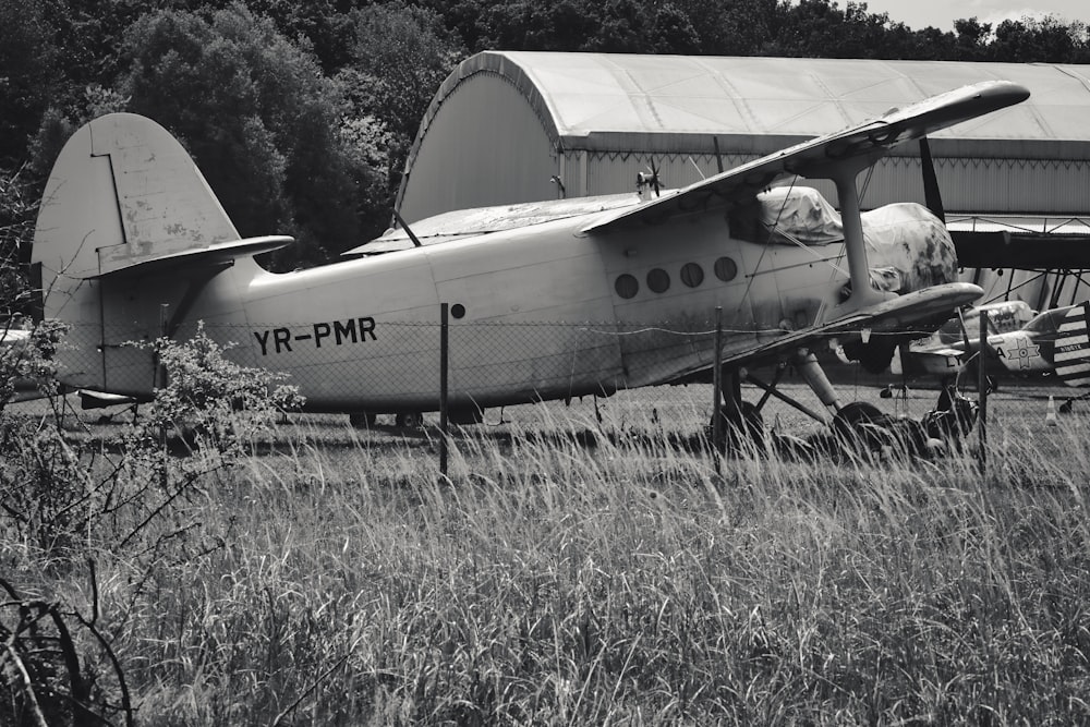 a black and white photo of a small airplane