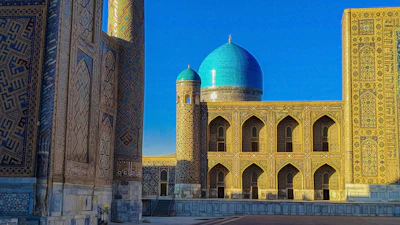 The turquoise dome and tiled facades of the Registan in Samarkand