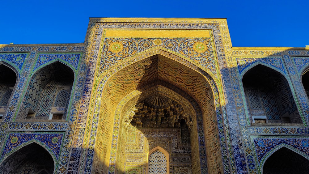 an ornate building with a blue sky in the background