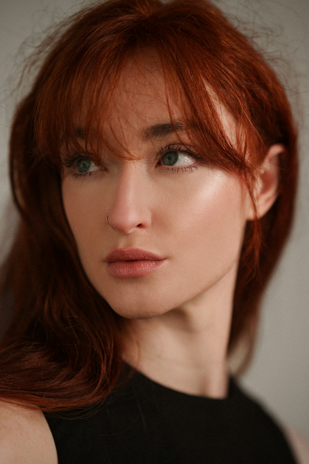 a close up of a woman with red hair