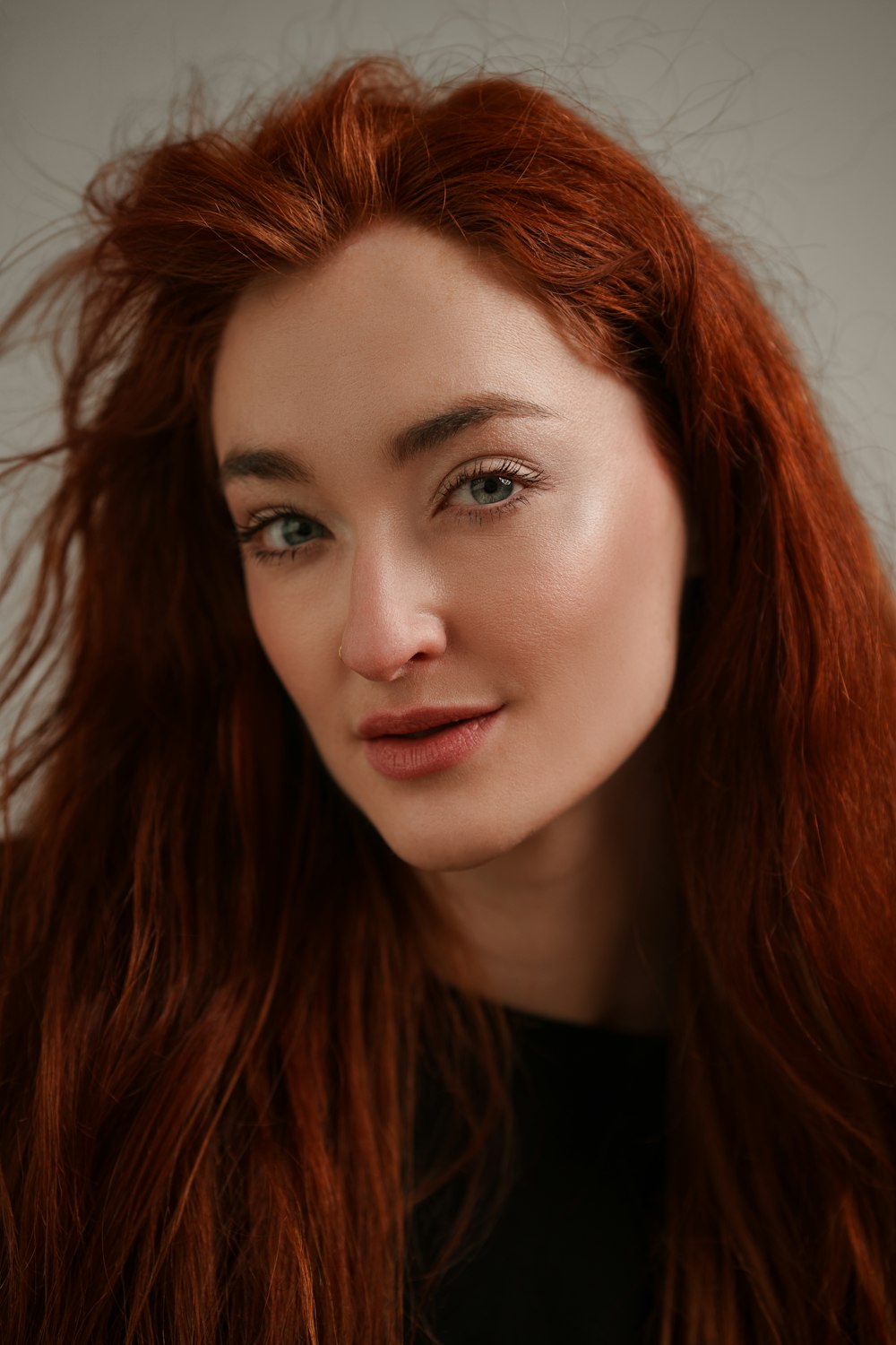 a close up of a woman with red hair