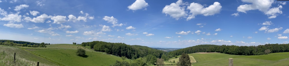 a panoramic view of a lush green valley