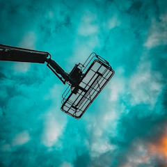 a view of the sky from below of a crane