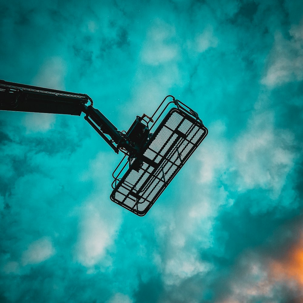 a view of the sky from below of a crane