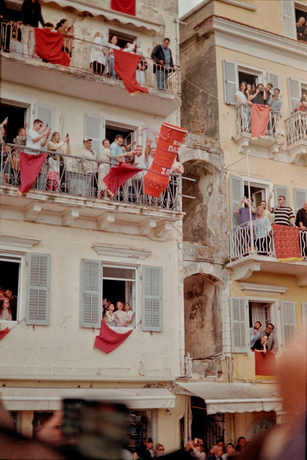 a group of people standing on top of balconies