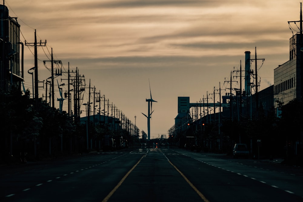 a street with a lot of telephone poles on both sides of it