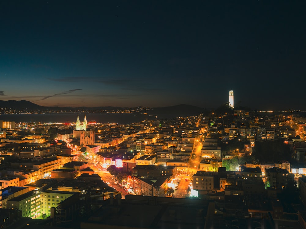 a view of a city at night from the top of a building