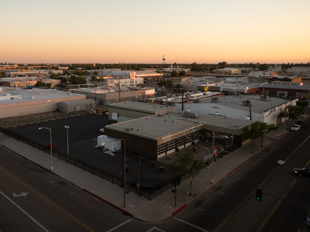 an aerial view of a city at sunset