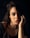 a woman with long hair posing for a picture