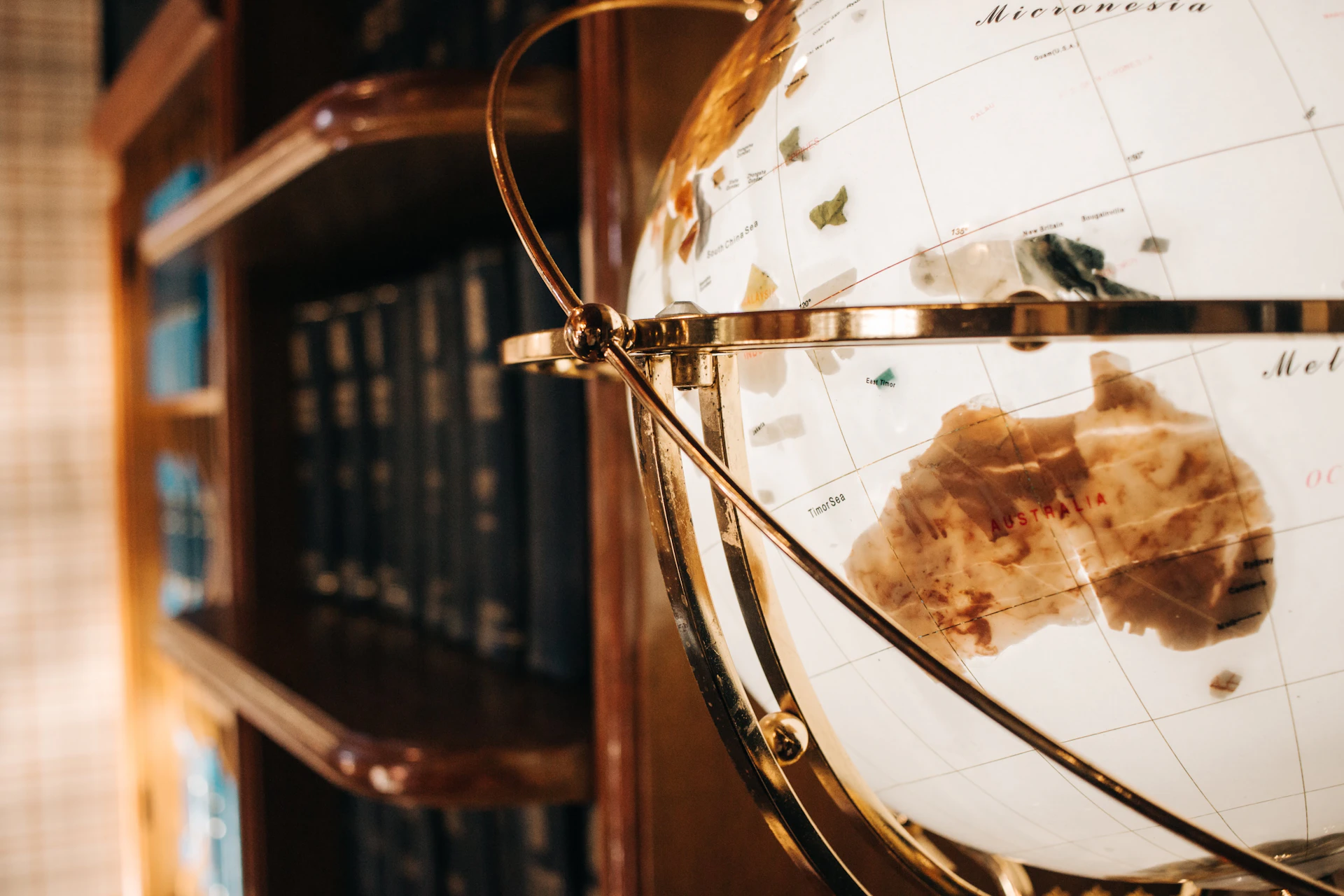 a close up of a globe on a shelf