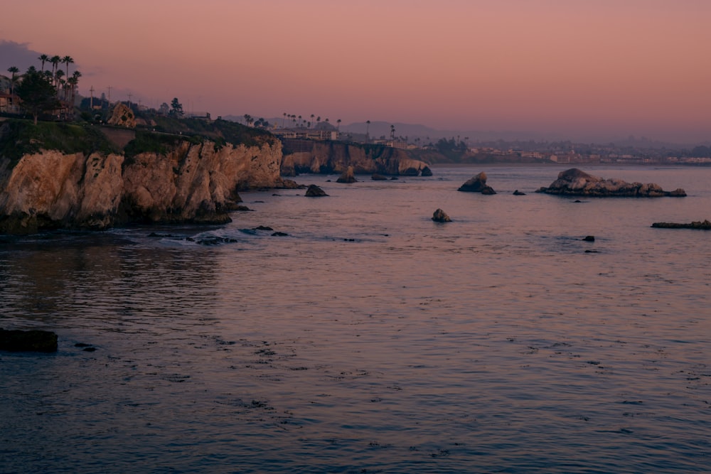 a body of water that has some rocks in it