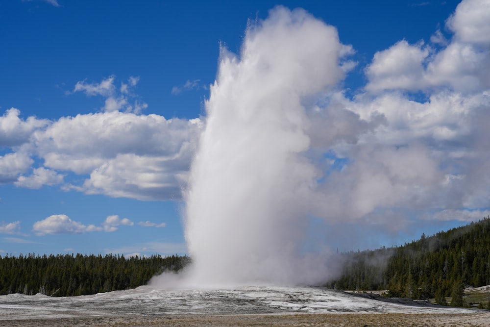 a large geyser spewing water into the sky
