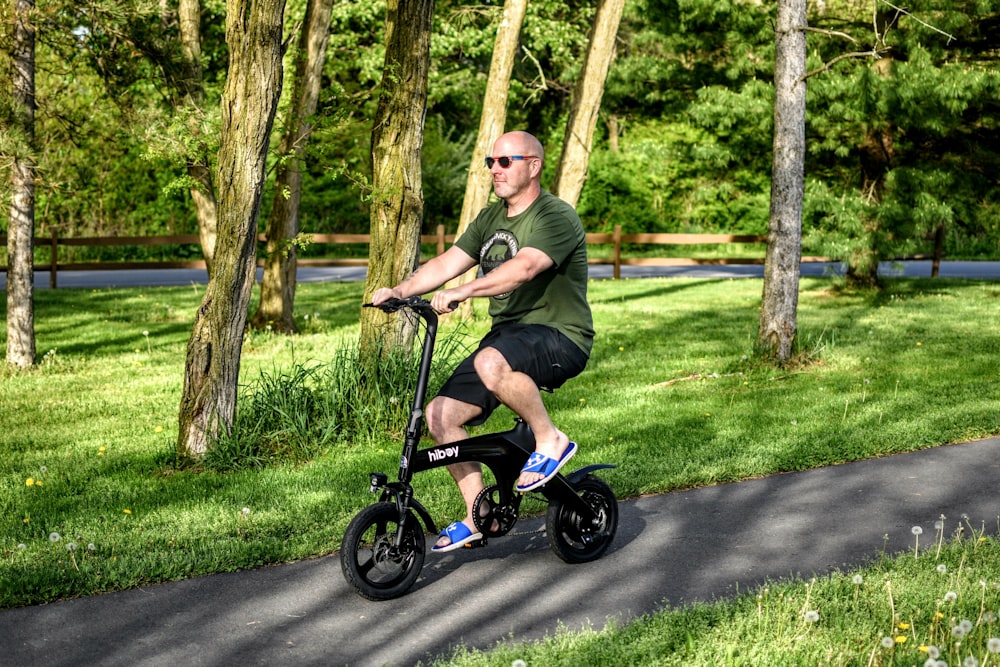 a man riding an electric scooter on a path