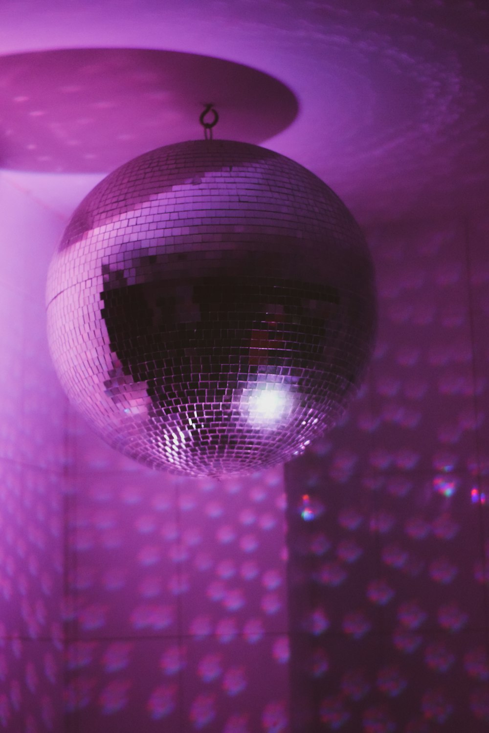a disco ball hanging from a ceiling in a room