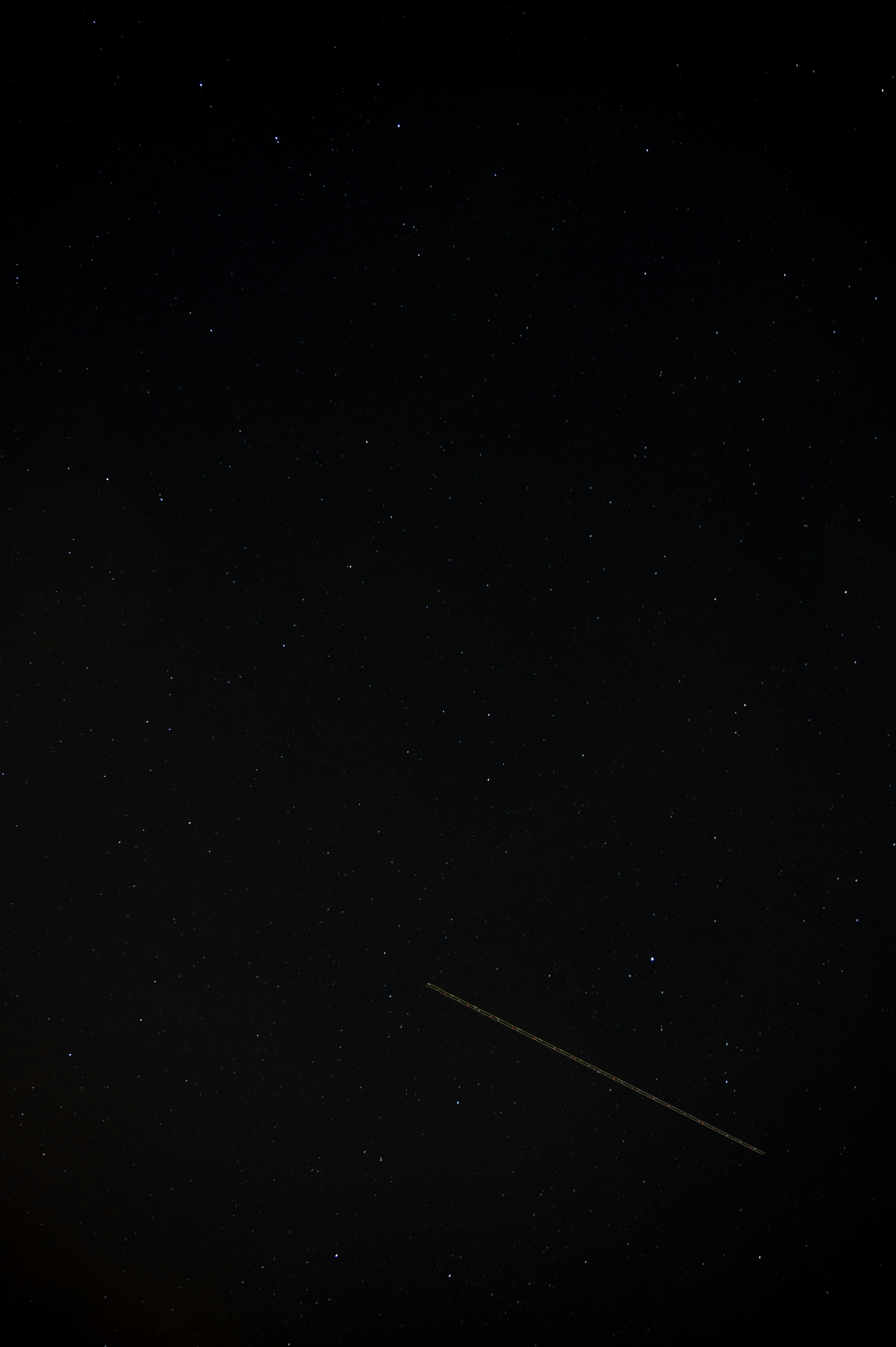 a plane flying in the sky at night