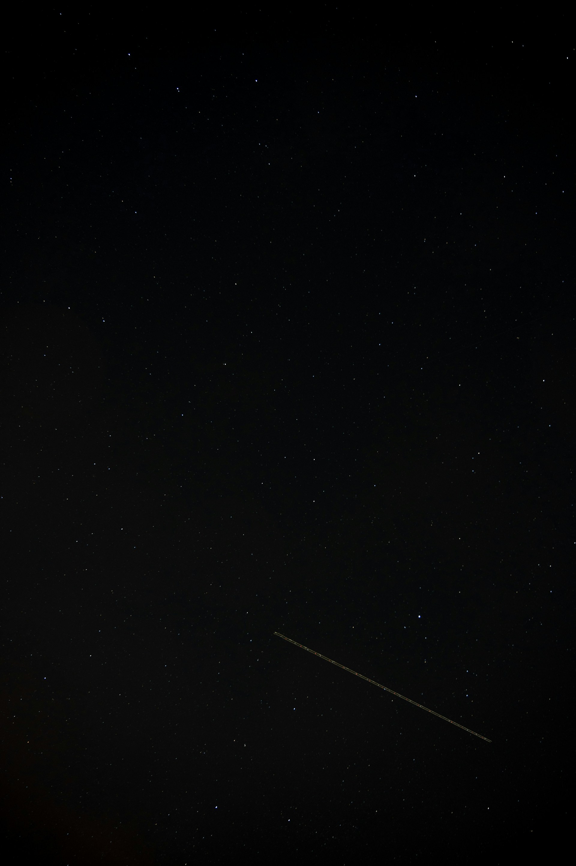 a plane flying in the sky at night