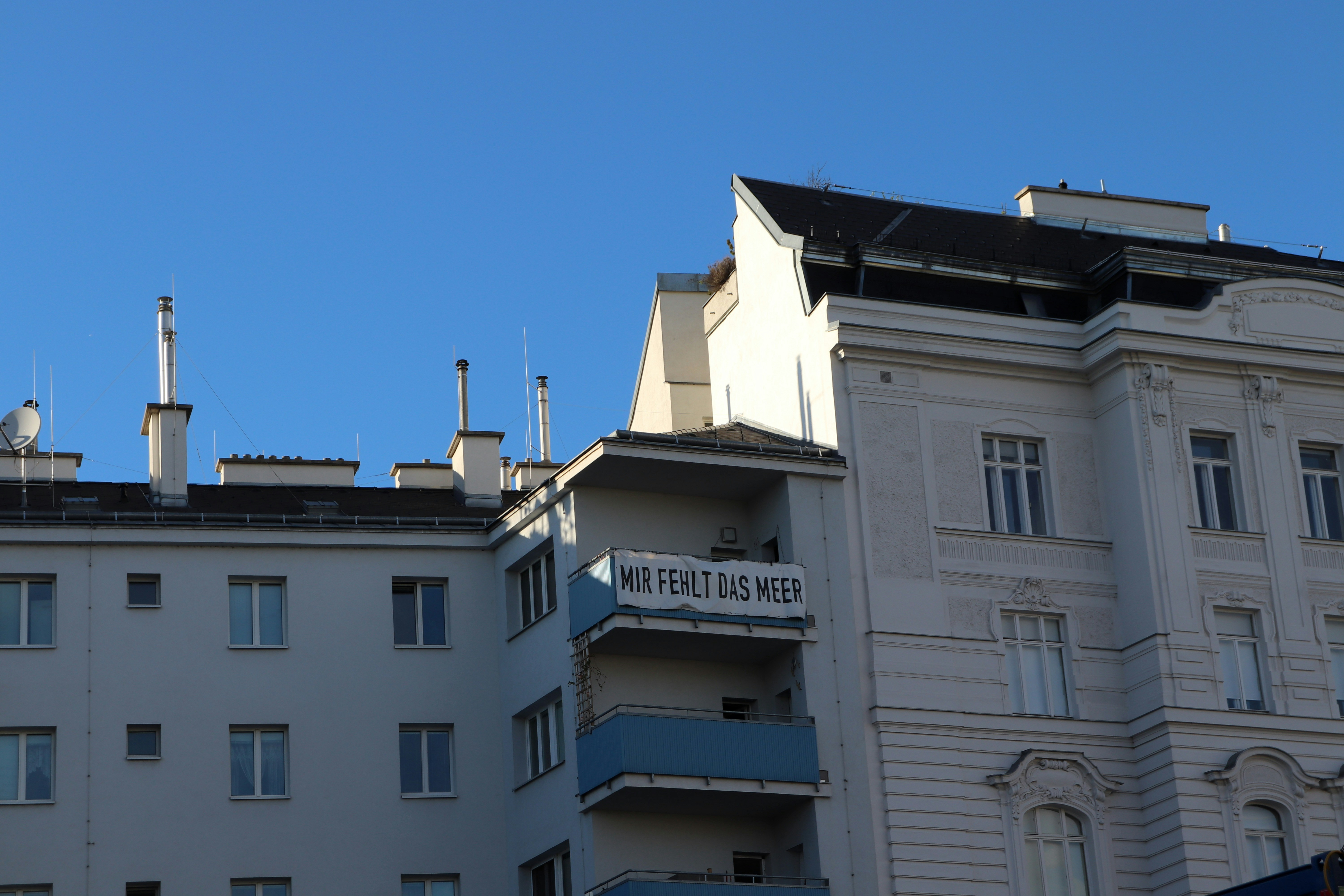 a white building with a sign on top of it