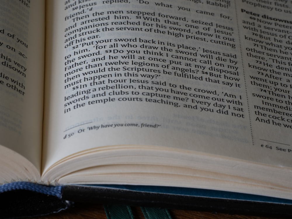 a close up of an open book on a table