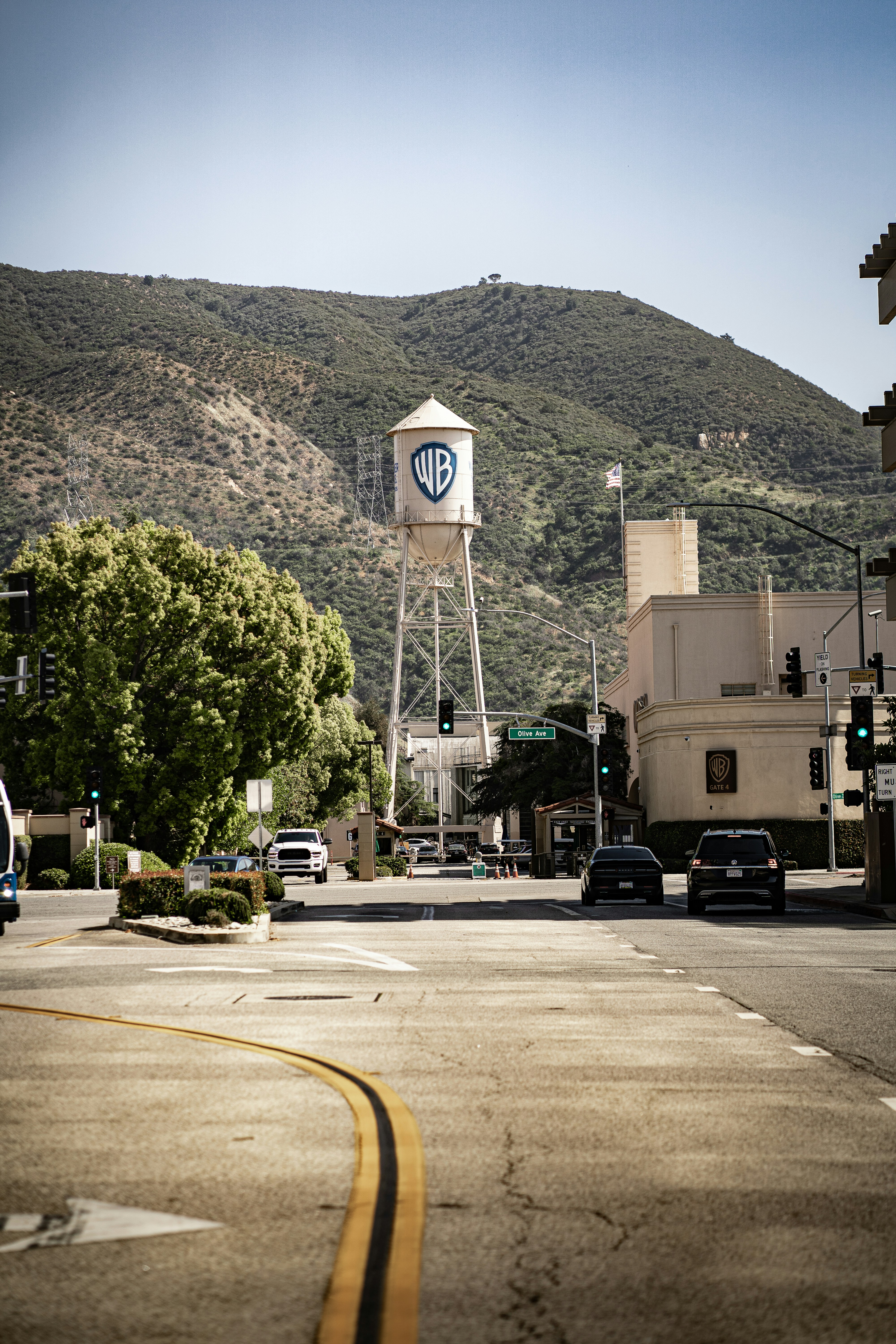a city street with a water tower in the background