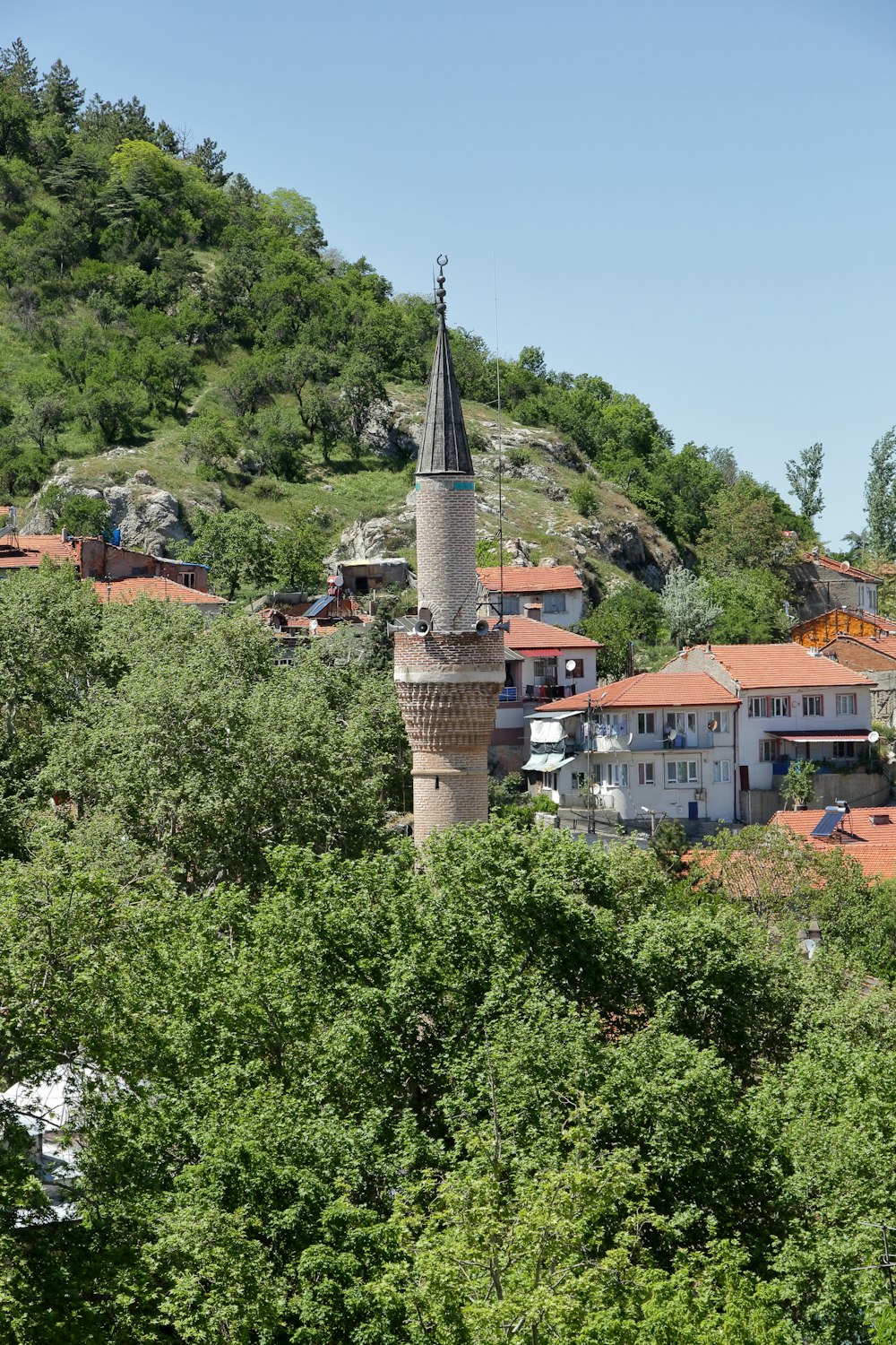 a tall tower with a clock on top of it