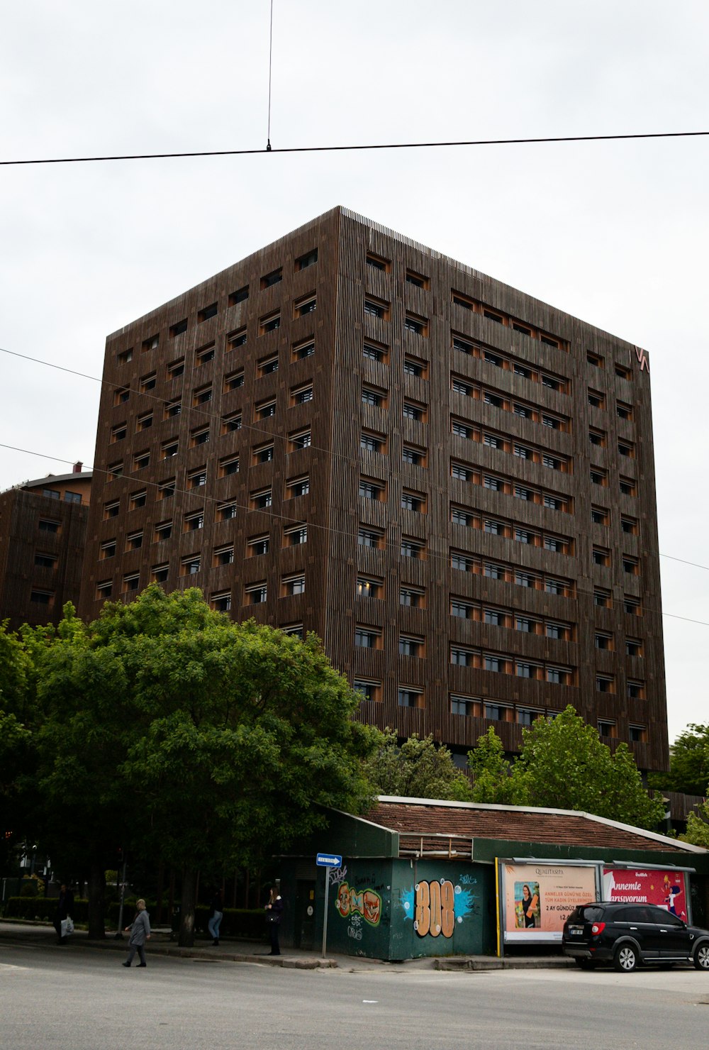a large brown building with lots of windows