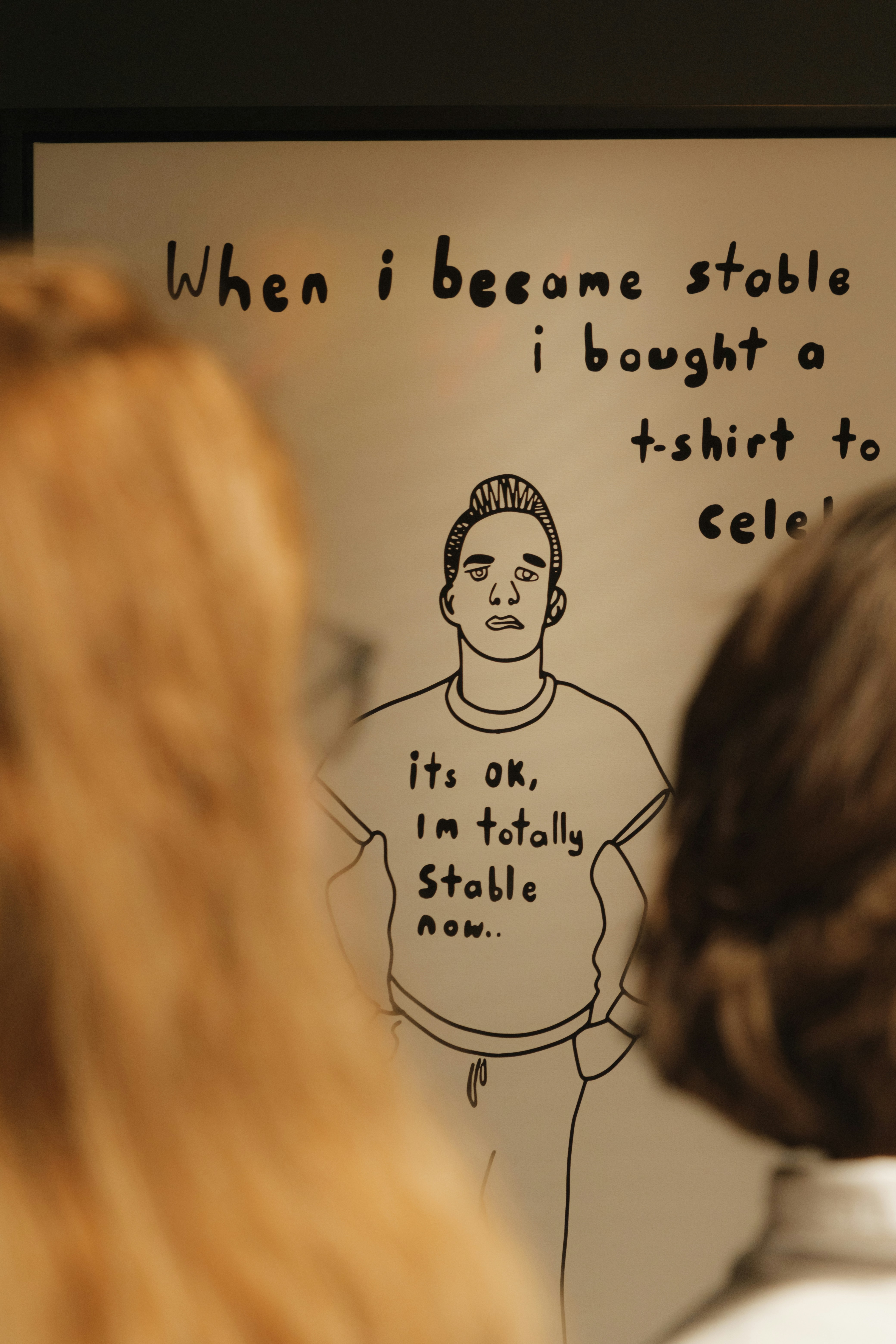 a woman standing in front of a whiteboard with a drawing on it